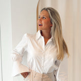 White flaired blouse