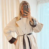 Trenchcoat with leather detail